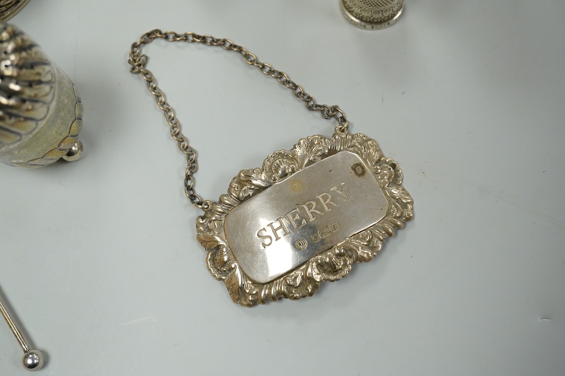 A collection silver and white metal to include a cased set of six George V seal top coffee spoons, Birmingham, 1927, a pair of Scottish napkin rings embossed with thistles, a pair of embossed heart shaped bonbon dishes,